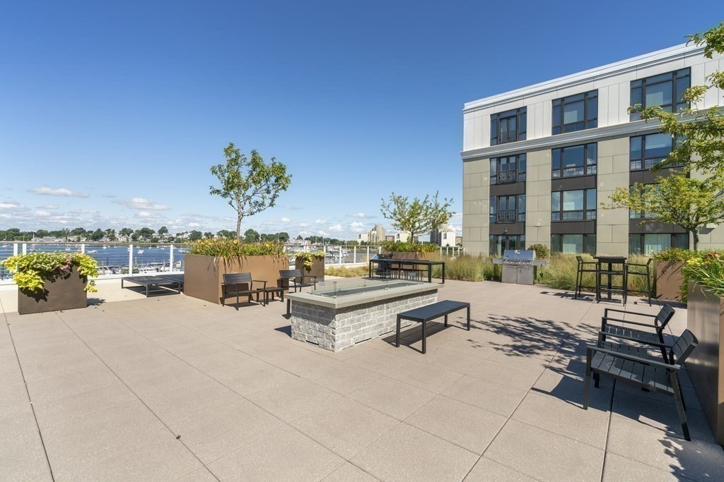 10 Shipyard Drive, Unit 312 Hingham, MA 02043 - Photo 33 of 35 a building outdoor space with patio furniture and potted plants