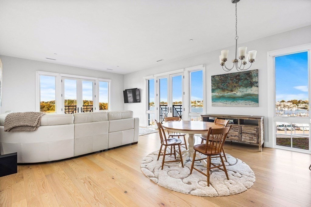 10 Shipyard Drive, Unit 312 Hingham, MA 02043 - Photo 5 of 35 a living room with furniture and a wooden floor