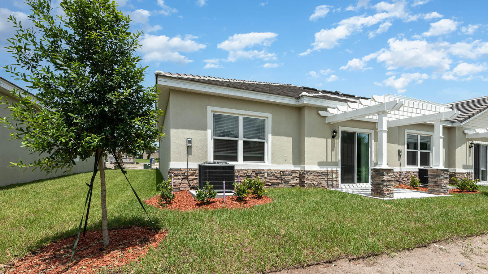 3435 Morrow Place Mims, FL 32754 - Photo 14 of 42 a front view of house with yard and outdoor seating