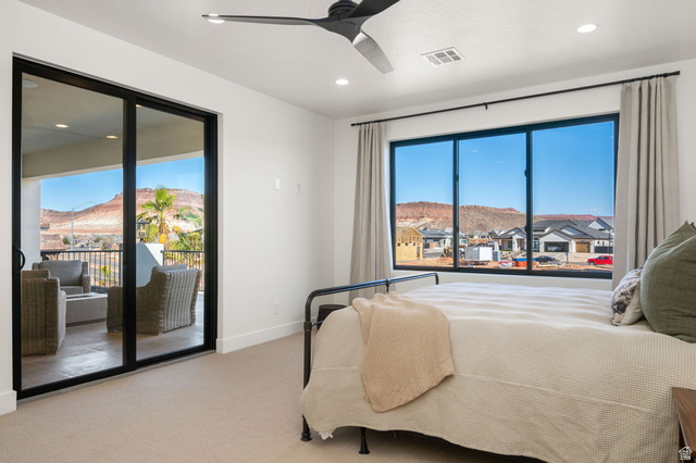 4871 South Homestead Way Washington, UT 84780 - Photo 80 of 151 Carpeted bedroom with a mountain view, access to outside, a ceiling fan, and recessed lighting