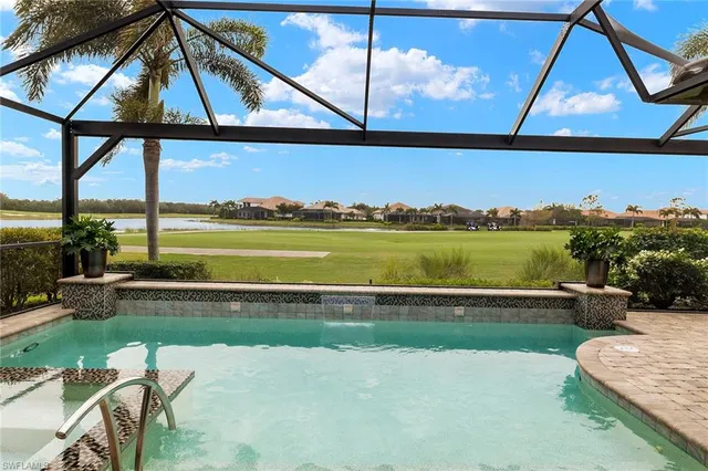 a view of swimming pool from a balcony