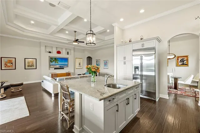 a kitchen with stainless steel appliances granite countertop a stove and refrigerator