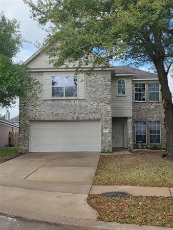 a front view of a house with garage