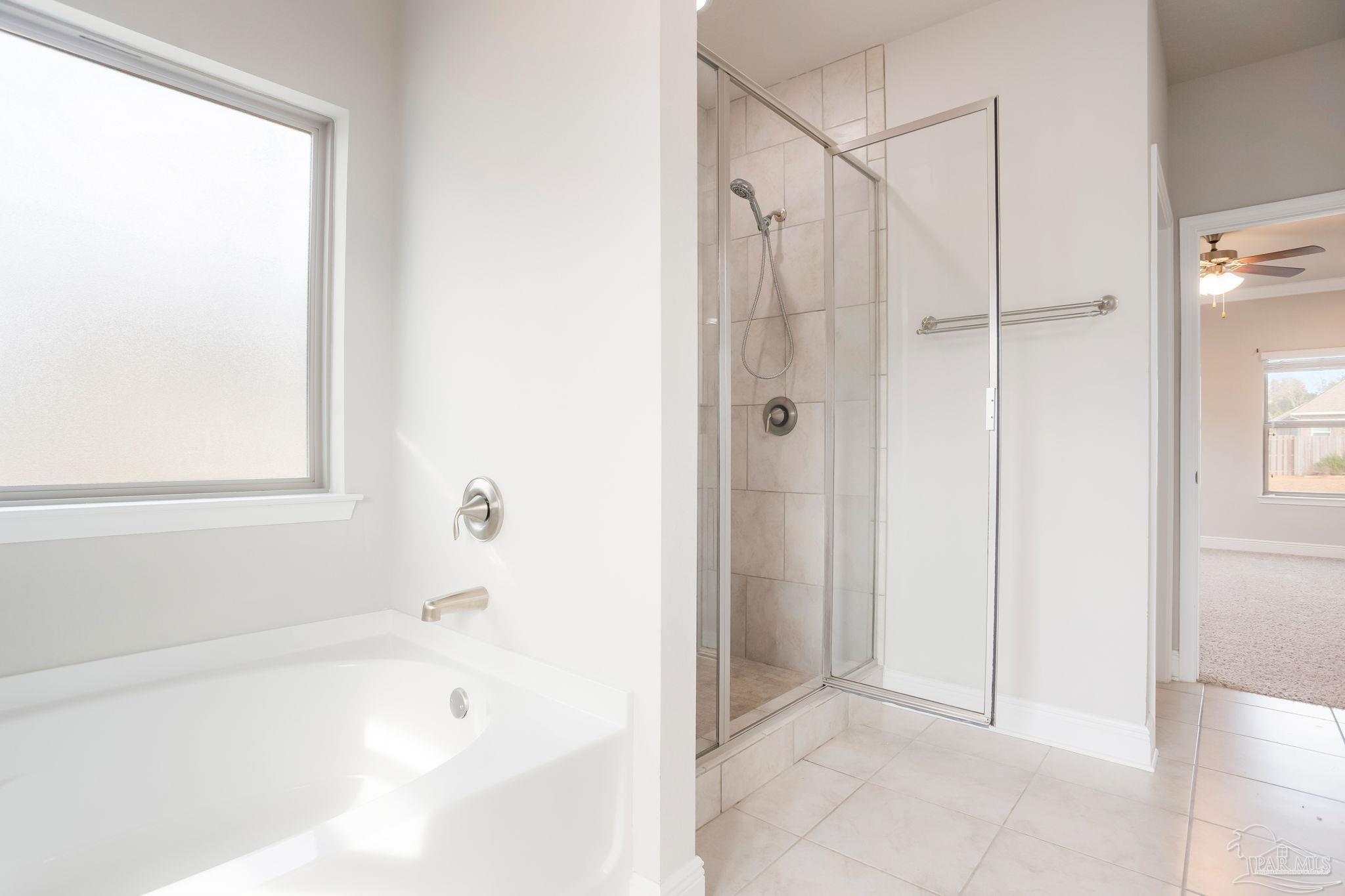 8016 Woodbrook Road Pensacola, FL 32526 - Photo 24 of 52 a bathroom with a bathtub and a shower