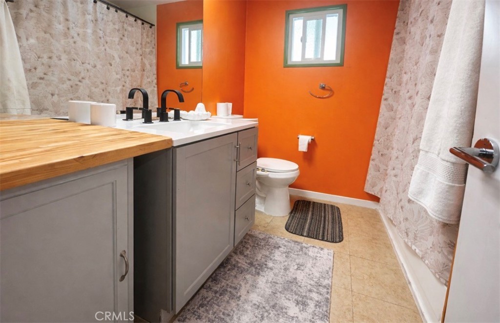 13870 Rodeo Drive Victorville, CA 92395 - Photo 13 of 22 a bathroom with a sink and a toilet