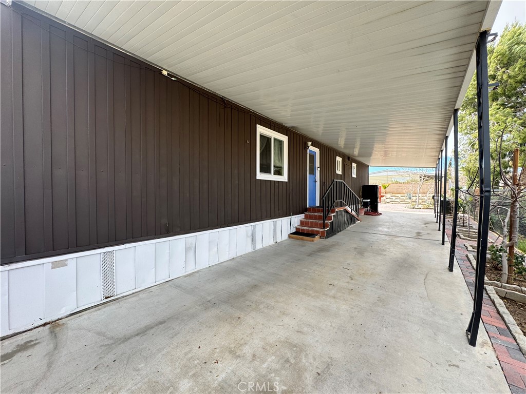 13870 Rodeo Drive Victorville, CA 92395 - Photo 18 of 22 a view of outdoor space with porch