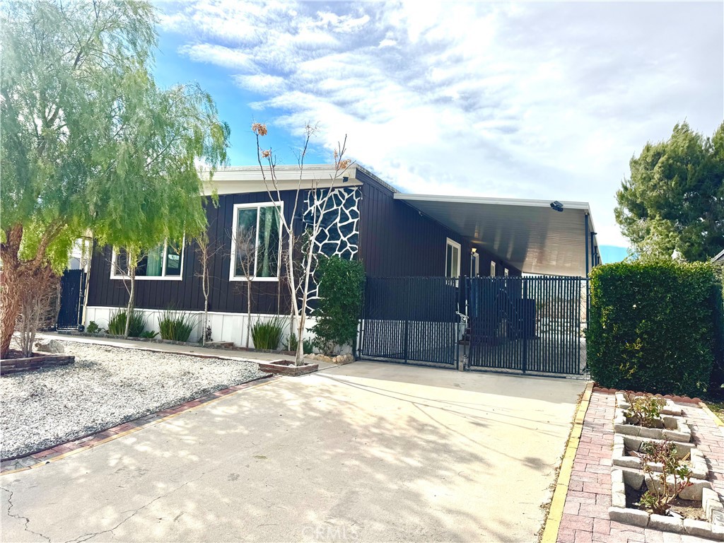 13870 Rodeo Drive Victorville, CA 92395 - Photo 3 of 22 a view of a house with a yard