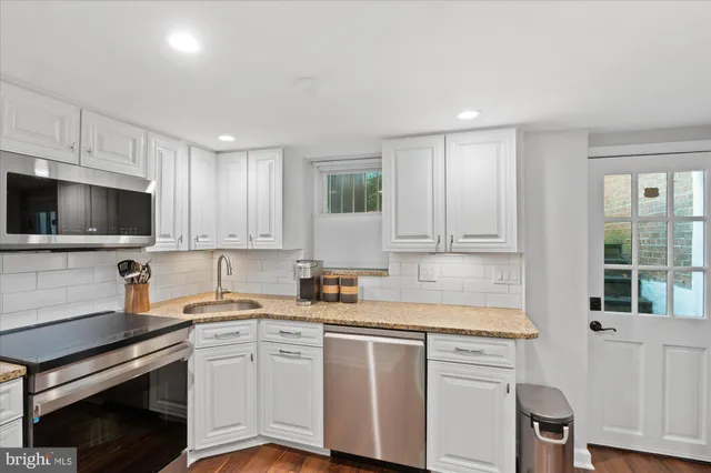 a bedroom with a bed and a couch