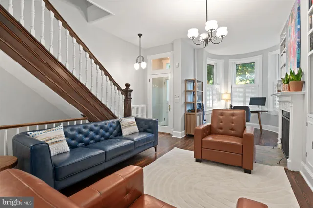 a workspace with furniture window and wooden floor