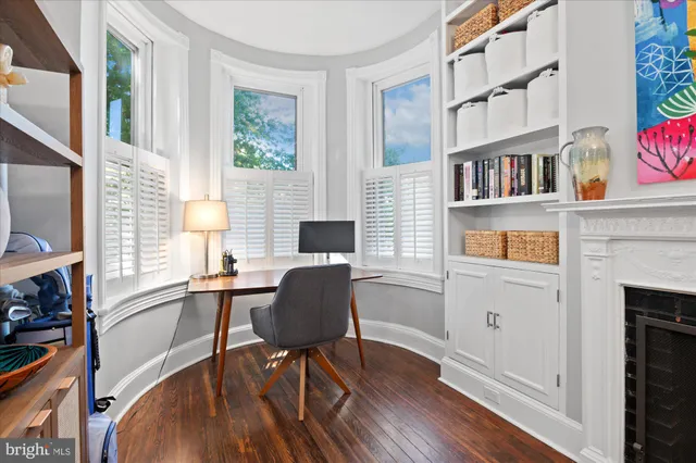 a bathroom with a sink mirror and toilet
