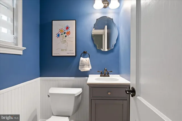 a view of kitchen with cabinets and wooden floor