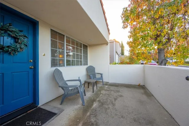 a view of a chair and table in the room
