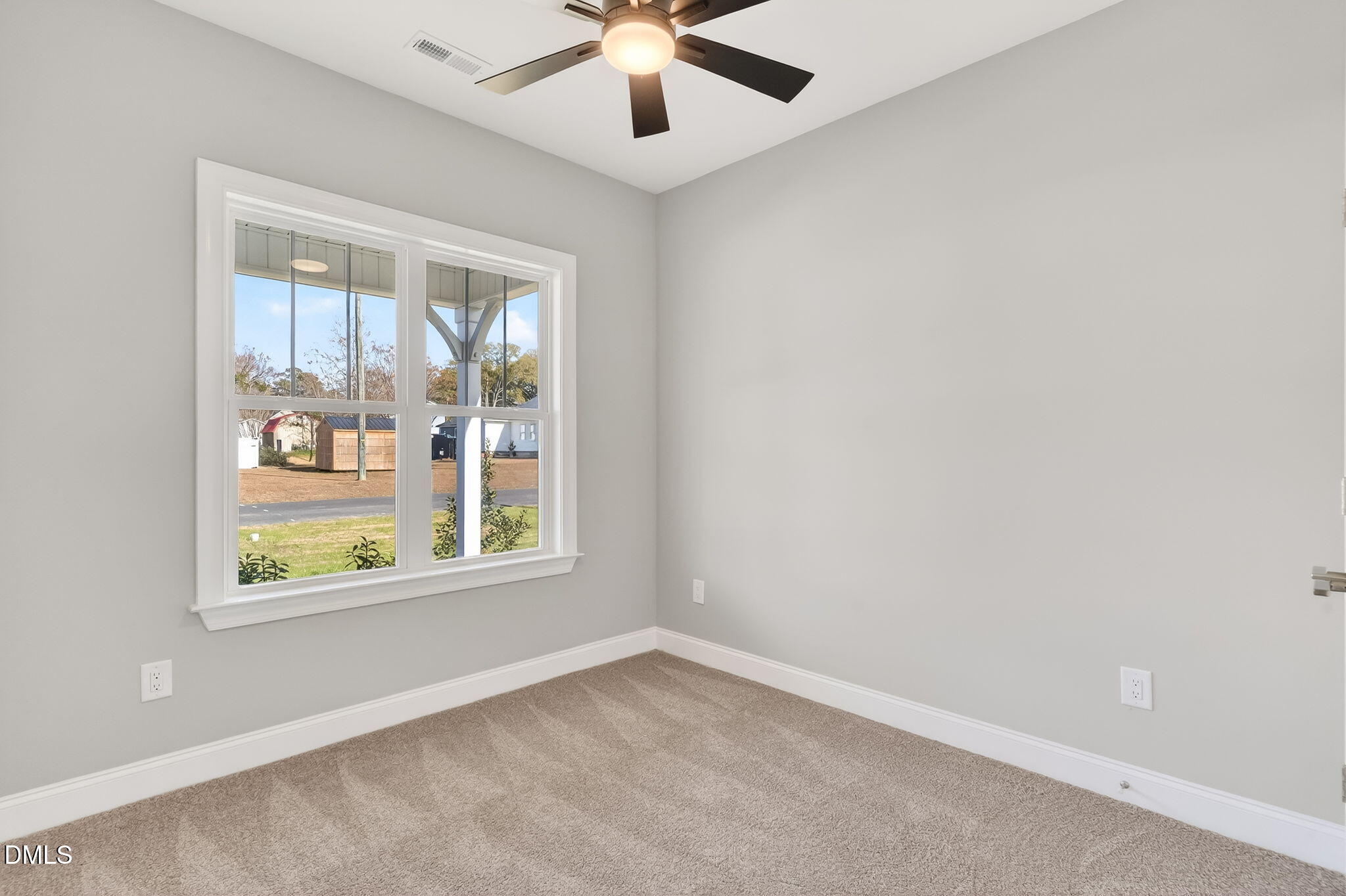 609 West Godwin Street Dunn, NC 28334 - Photo 15 of 38 an empty room with window and windows