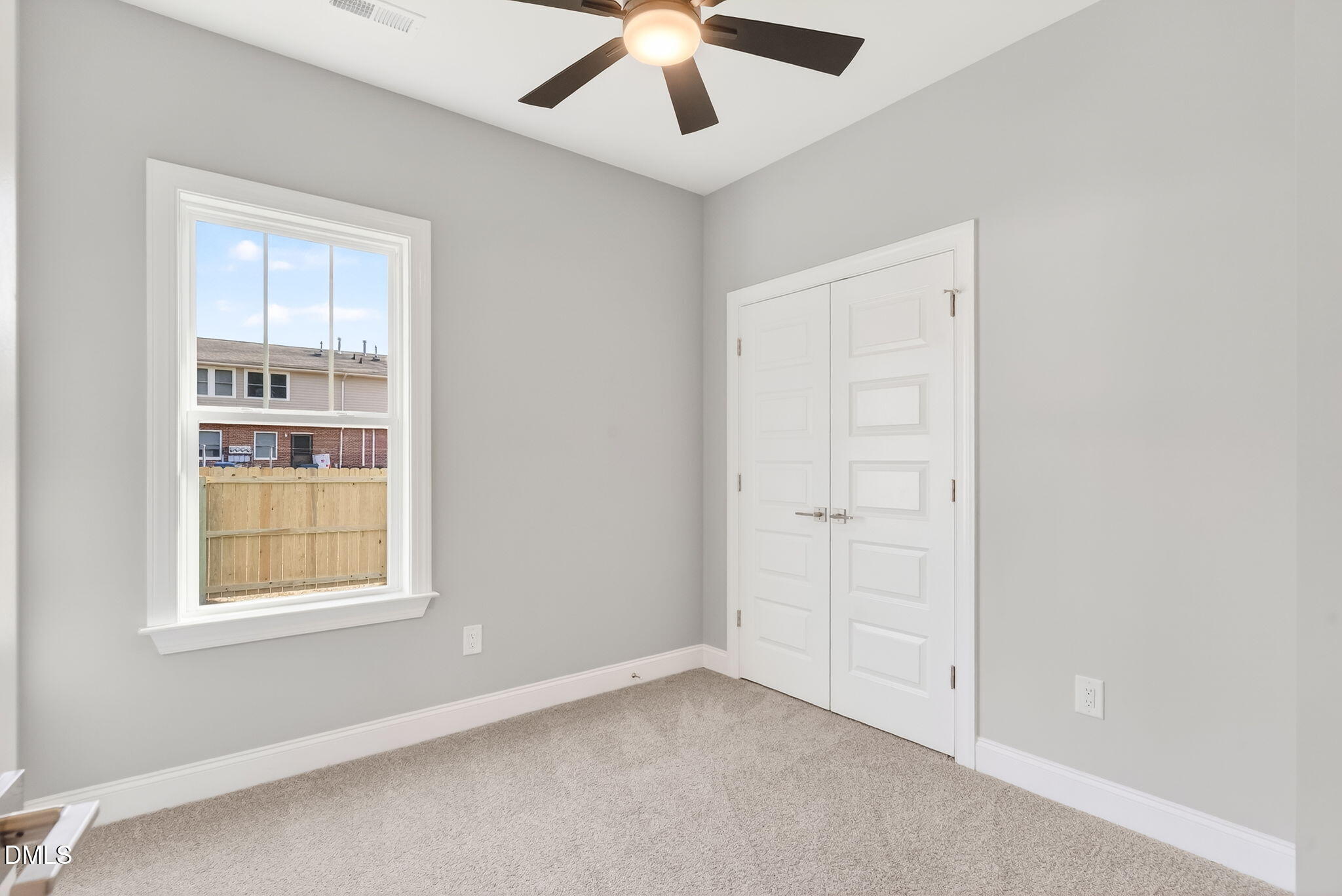 609 West Godwin Street Dunn, NC 28334 - Photo 18 of 38 an empty room with chandelier fan