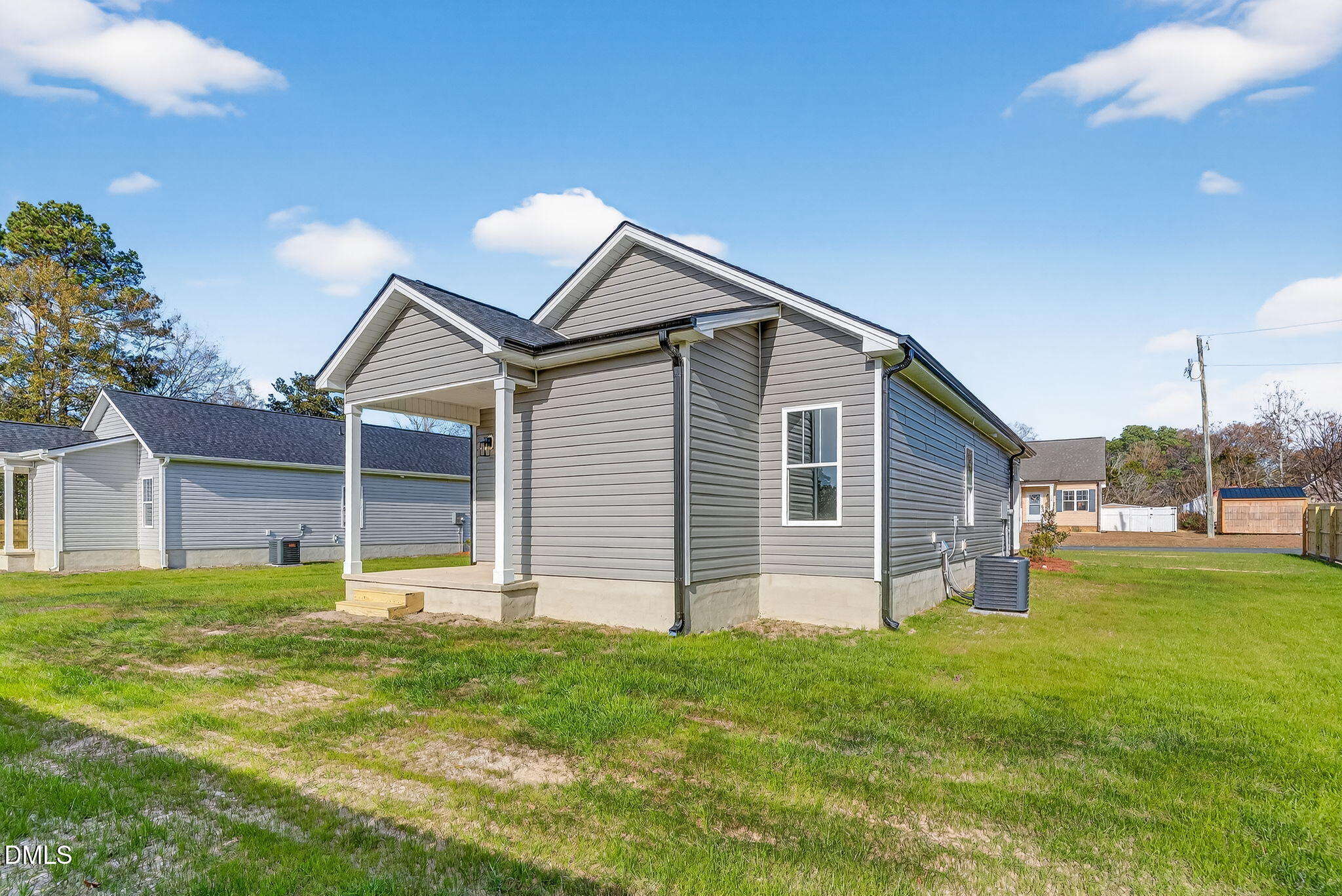 609 West Godwin Street Dunn, NC 28334 - Photo 28 of 38 a view of a house with a yard