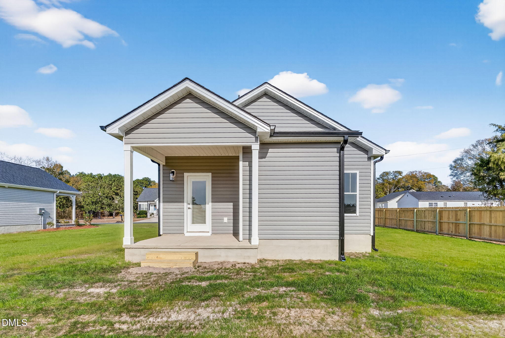 609 West Godwin Street Dunn, NC 28334 - Photo 29 of 38 a view of a house with a yard