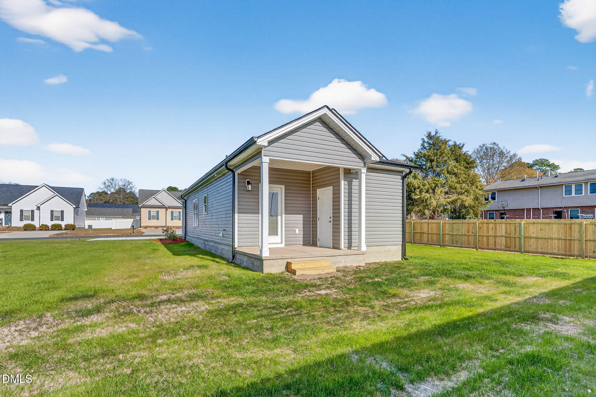 609 West Godwin Street Dunn, NC 28334 - Photo 30 of 38 a view of a house with a yard and pathway