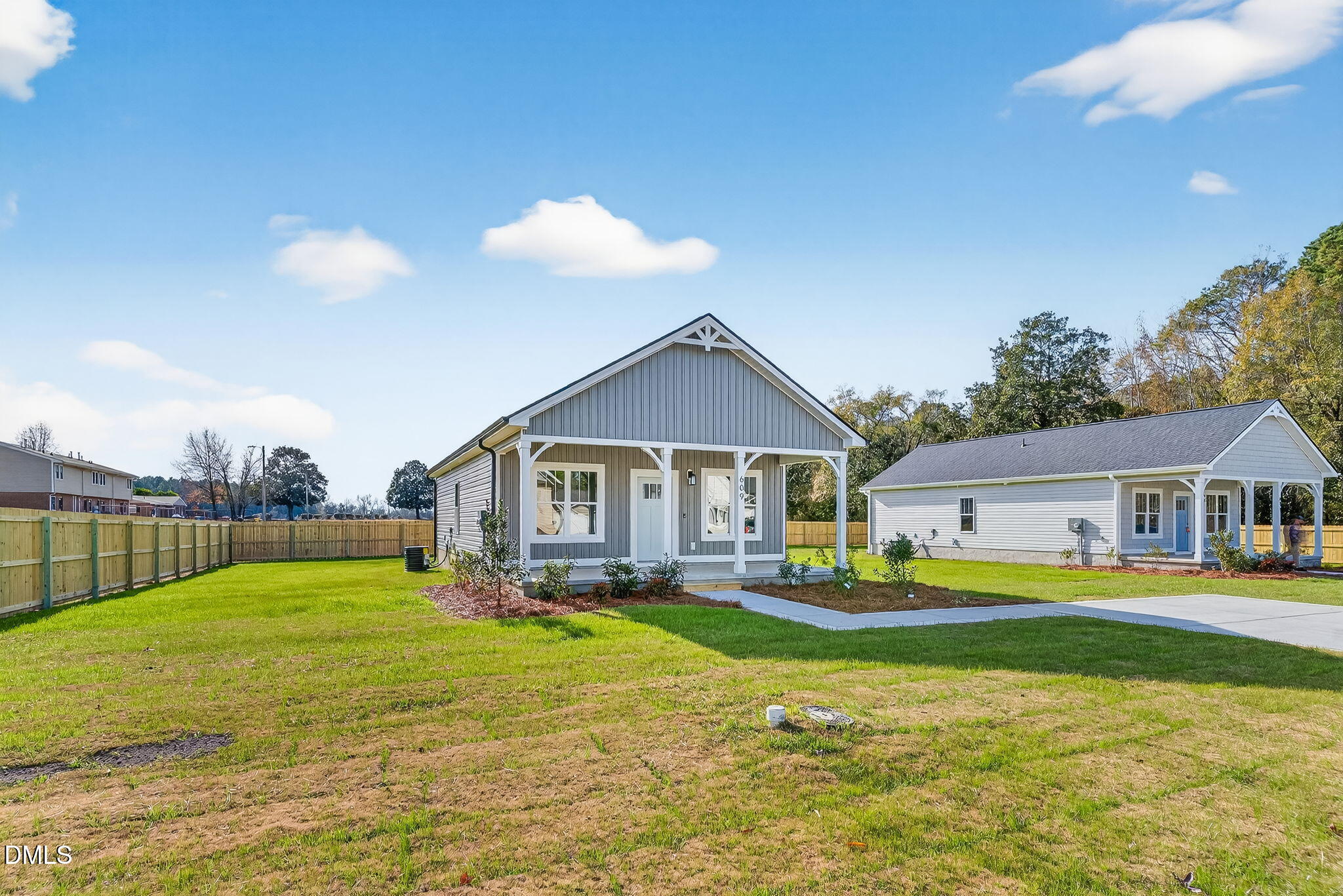 609 West Godwin Street Dunn, NC 28334 - Photo 3 of 38 a view of a house with a big yard