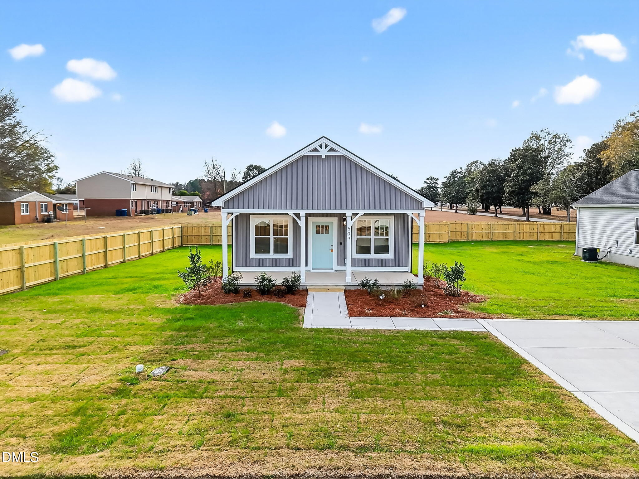 609 West Godwin Street Dunn, NC 28334 - Photo 33 of 38 a front view of a house with garden