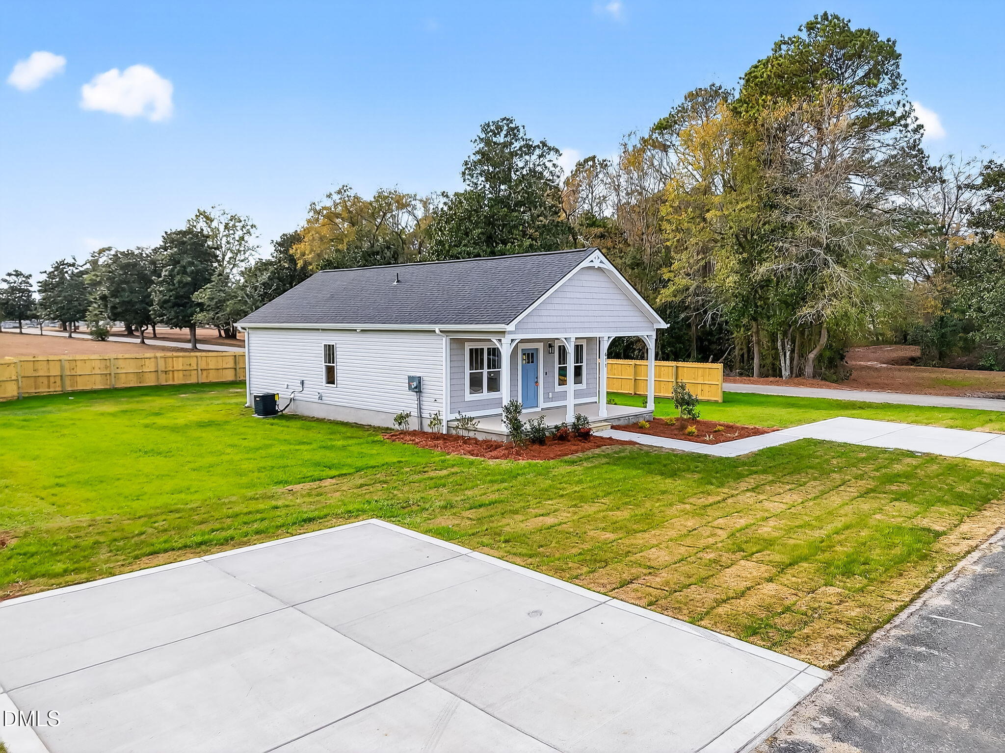 609 West Godwin Street Dunn, NC 28334 - Photo 34 of 38 a view of a house with a swimming pool