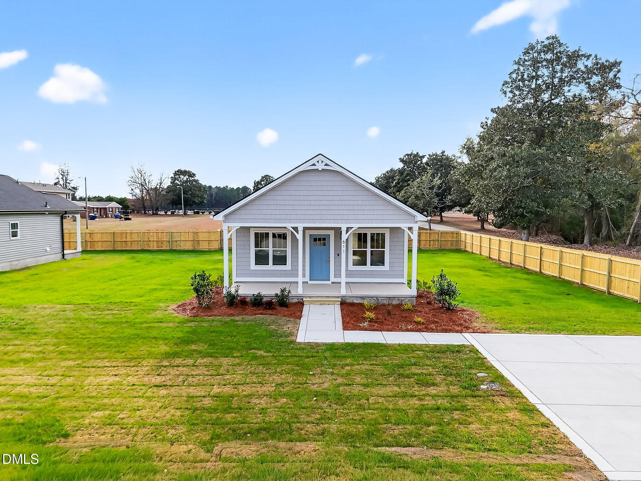 609 West Godwin Street Dunn, NC 28334 - Photo 35 of 38 a front view of a house with garden