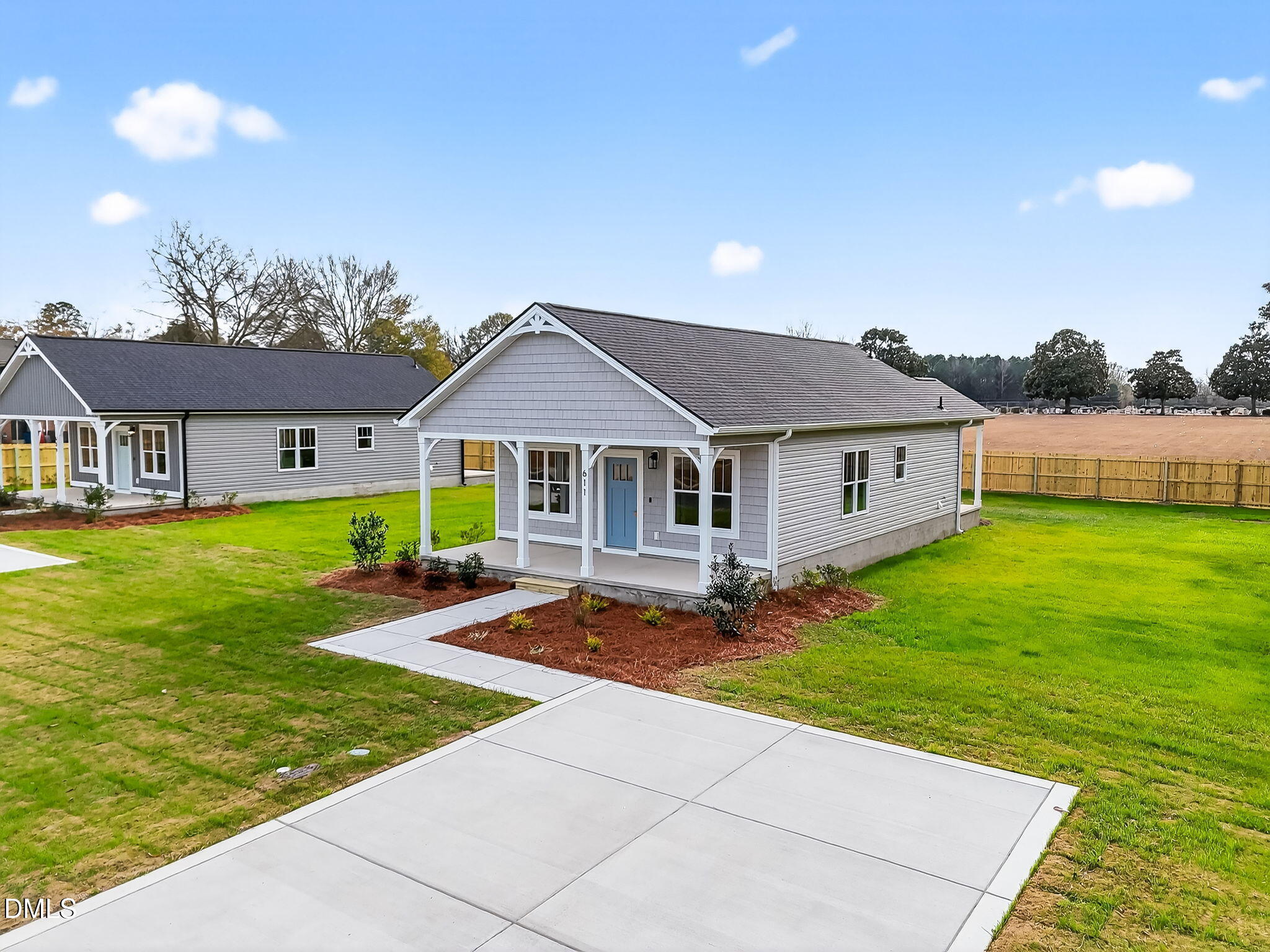 609 West Godwin Street Dunn, NC 28334 - Photo 36 of 38 a aerial view of a house with swimming pool and yard