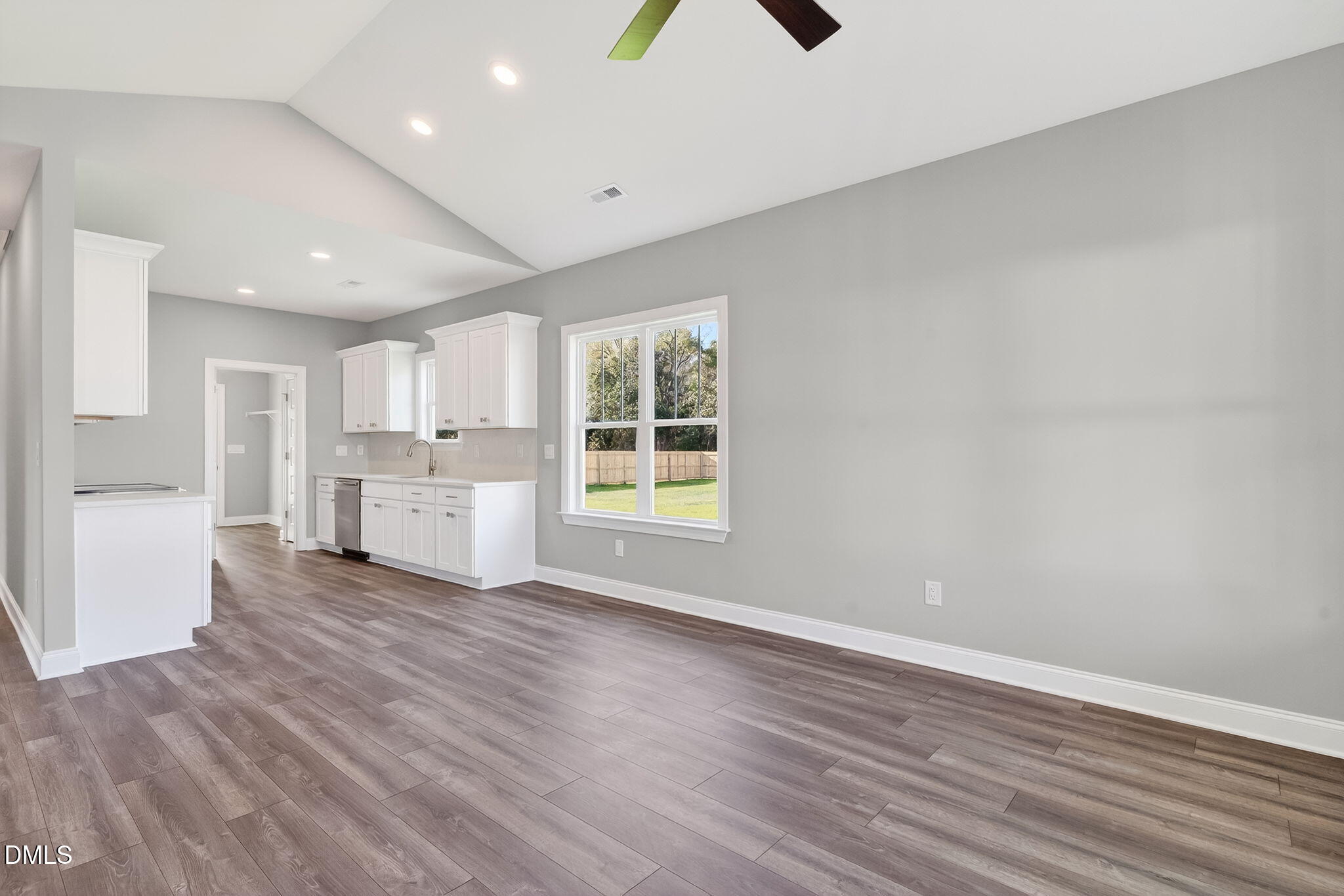 609 West Godwin Street Dunn, NC 28334 - Photo 8 of 38 a view of a kitchen with wooden floor and windows