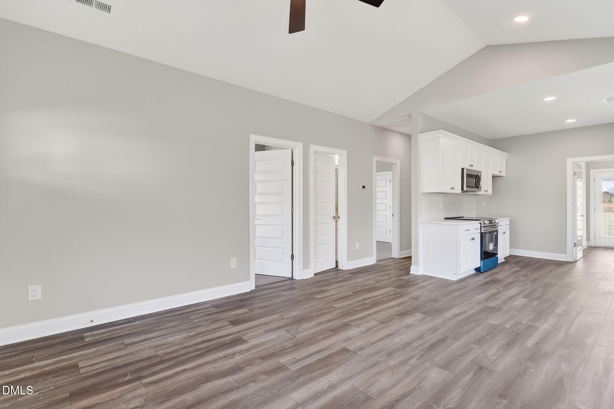 609 West Godwin Street Dunn, NC 28334 - Photo 9 of 38 a view of empty room with wooden floor and window