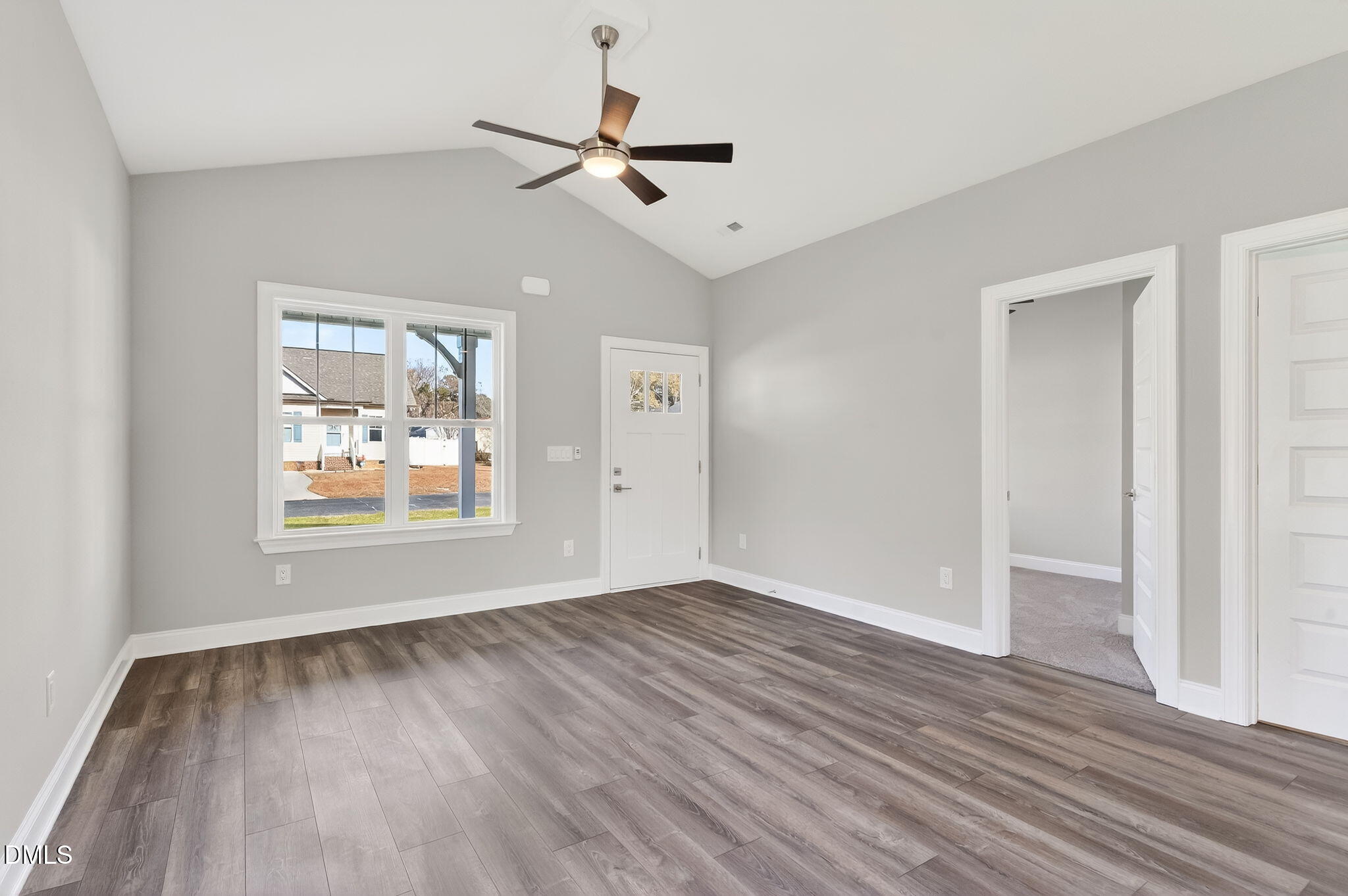 609 West Godwin Street Dunn, NC 28334 - Photo 10 of 38 wooden floor in an empty room with a window
