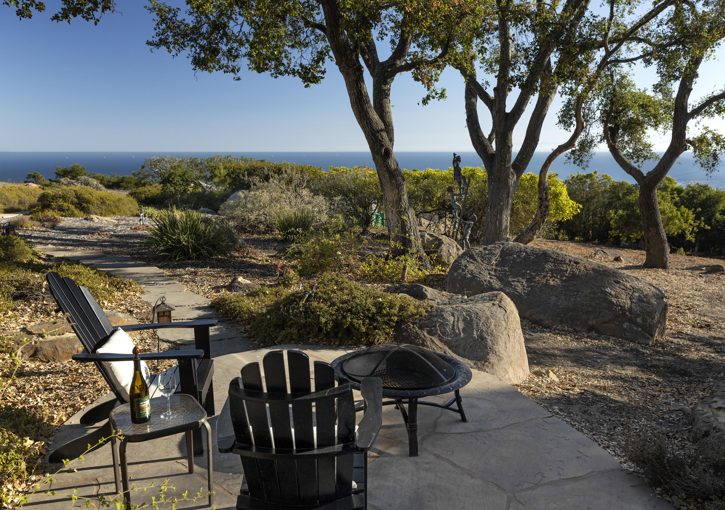 1215 High Ridge Lane Santa Barbara, CA 93103 - Photo 16 of 20 a roof deck with table and chairs under an umbrella