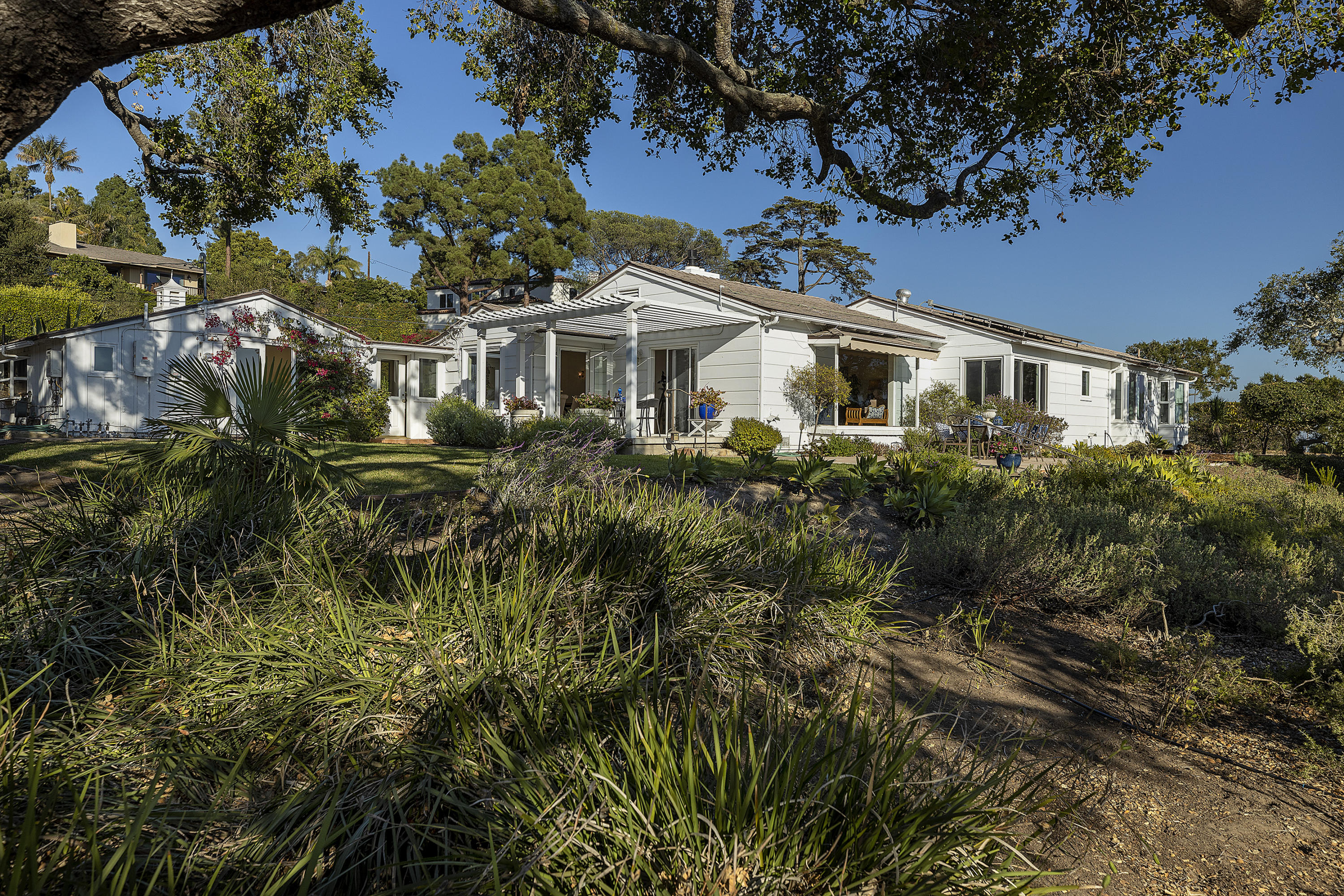 1215 High Ridge Lane Santa Barbara, CA 93103 - Photo 6 of 20 a front view of a house with a garden