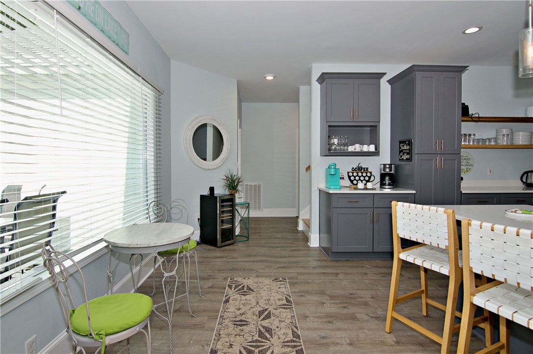 206 Petty Road Seneca, SC 29672 - Photo 10 of 49 Gleaming wood-look floors pair beautifully with crisp crown molding in this functional transition zone.