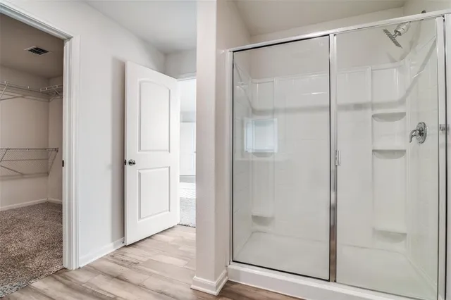 a bathroom with a granite countertop sink a toilet and a mirror