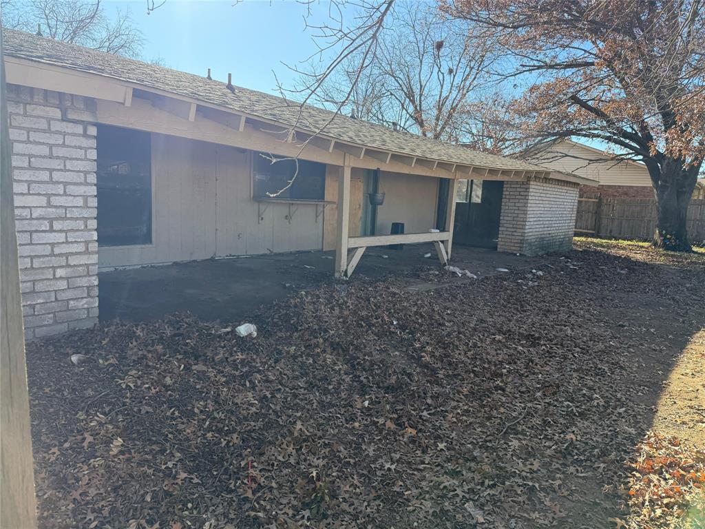 7200 Timber Trail Fort Worth, TX 76134 - Photo 16 of 18 a view of a house with a yard and garage