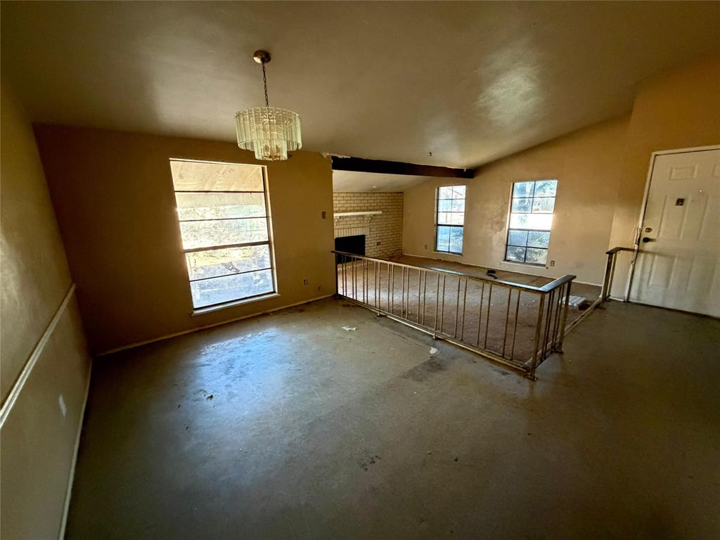 7200 Timber Trail Fort Worth, TX 76134 - Photo 3 of 18 a view of an empty room with a window