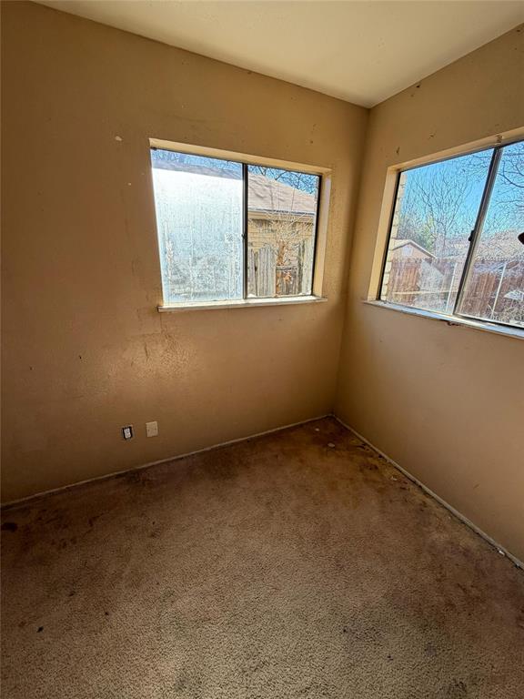 7200 Timber Trail Fort Worth, TX 76134 - Photo 7 of 18 an empty room with a window