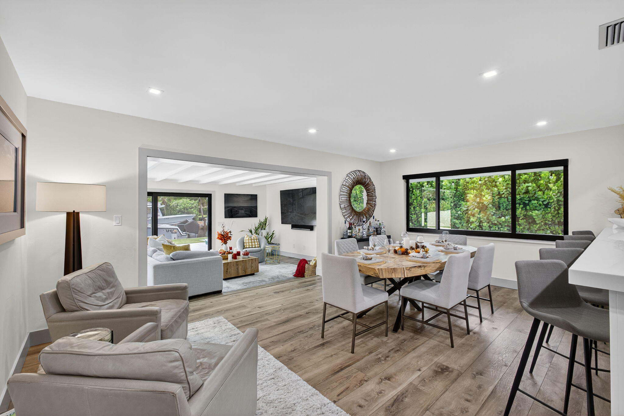 12 Leeward Circle Tequesta, FL 33469 - Photo 14 of 61 a living room with furniture and a large window