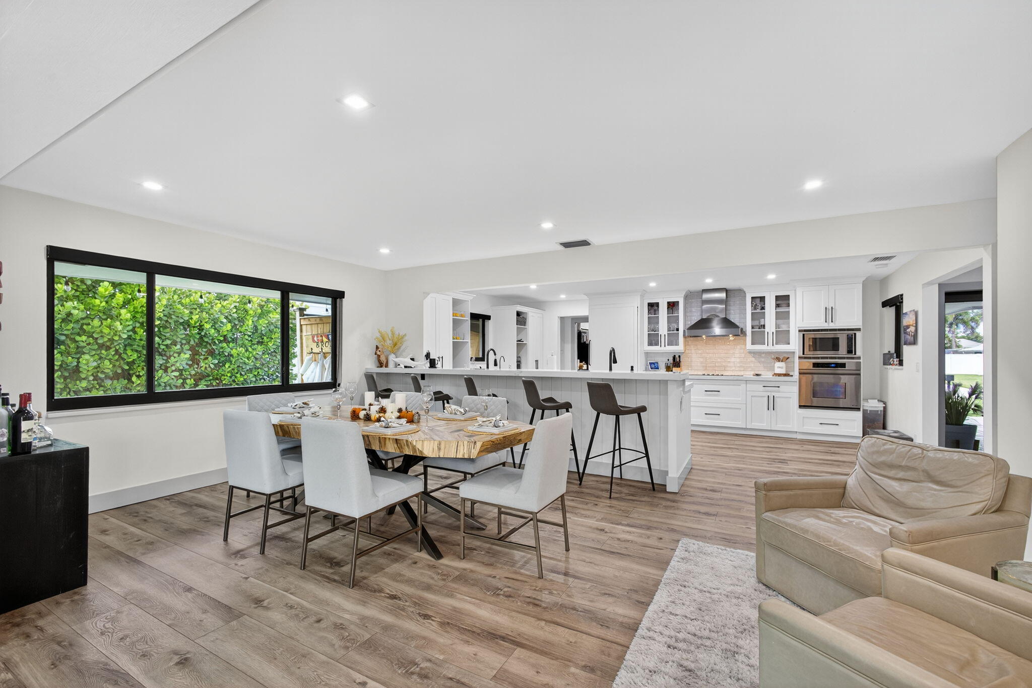 12 Leeward Circle Tequesta, FL 33469 - Photo 18 of 61 a living room with furniture and a large window