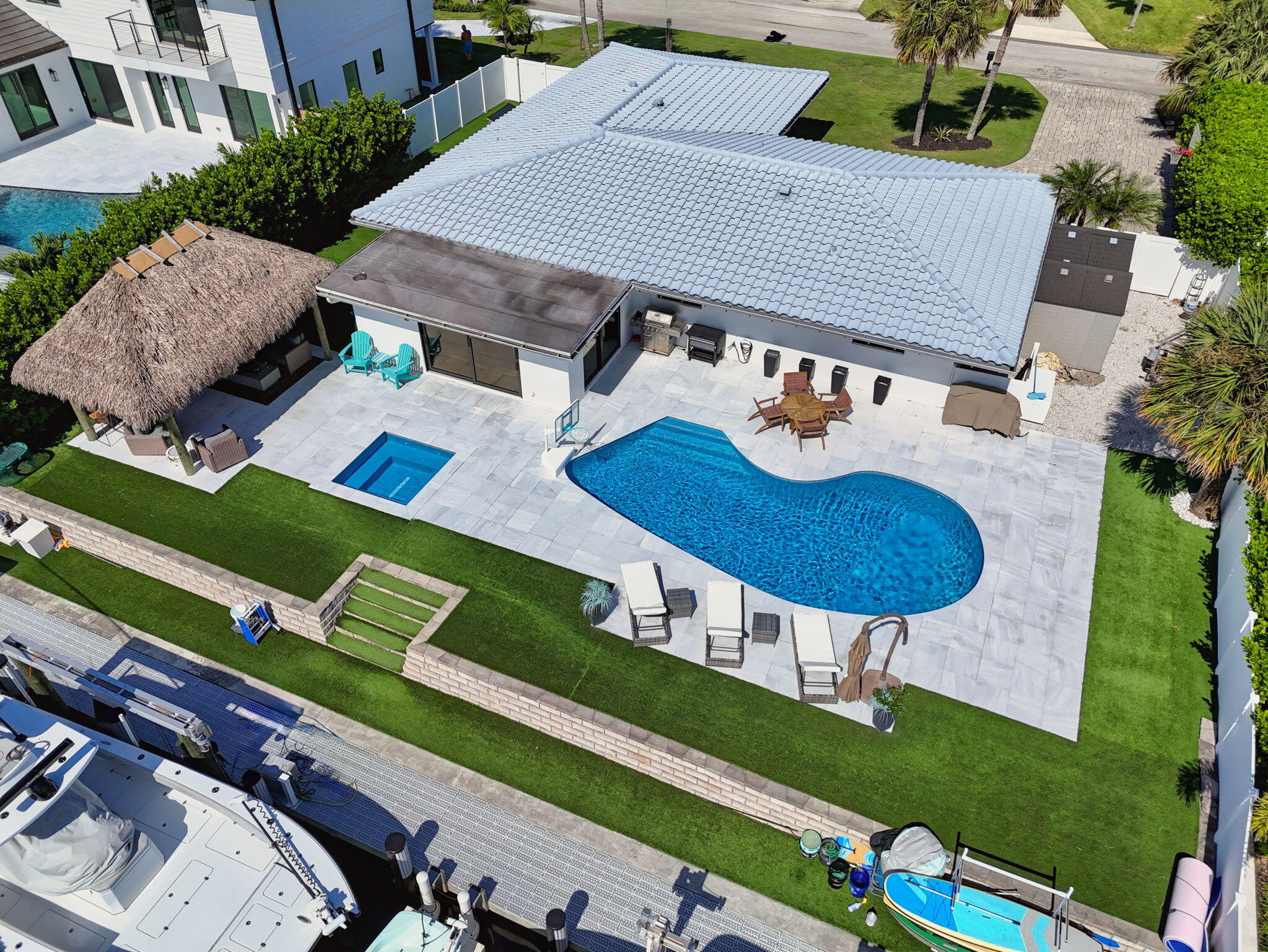 12 Leeward Circle Tequesta, FL 33469 - Photo 2 of 61 an aerial view of a house with garden space and street view