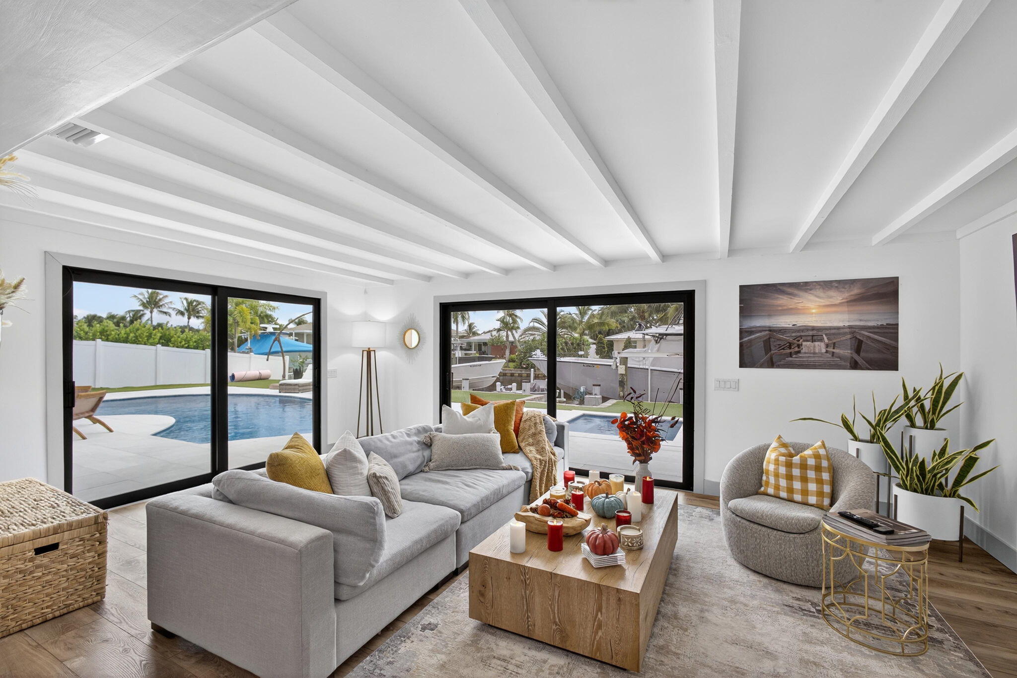 12 Leeward Circle Tequesta, FL 33469 - Photo 22 of 61 a living room with furniture and floor to ceiling windows