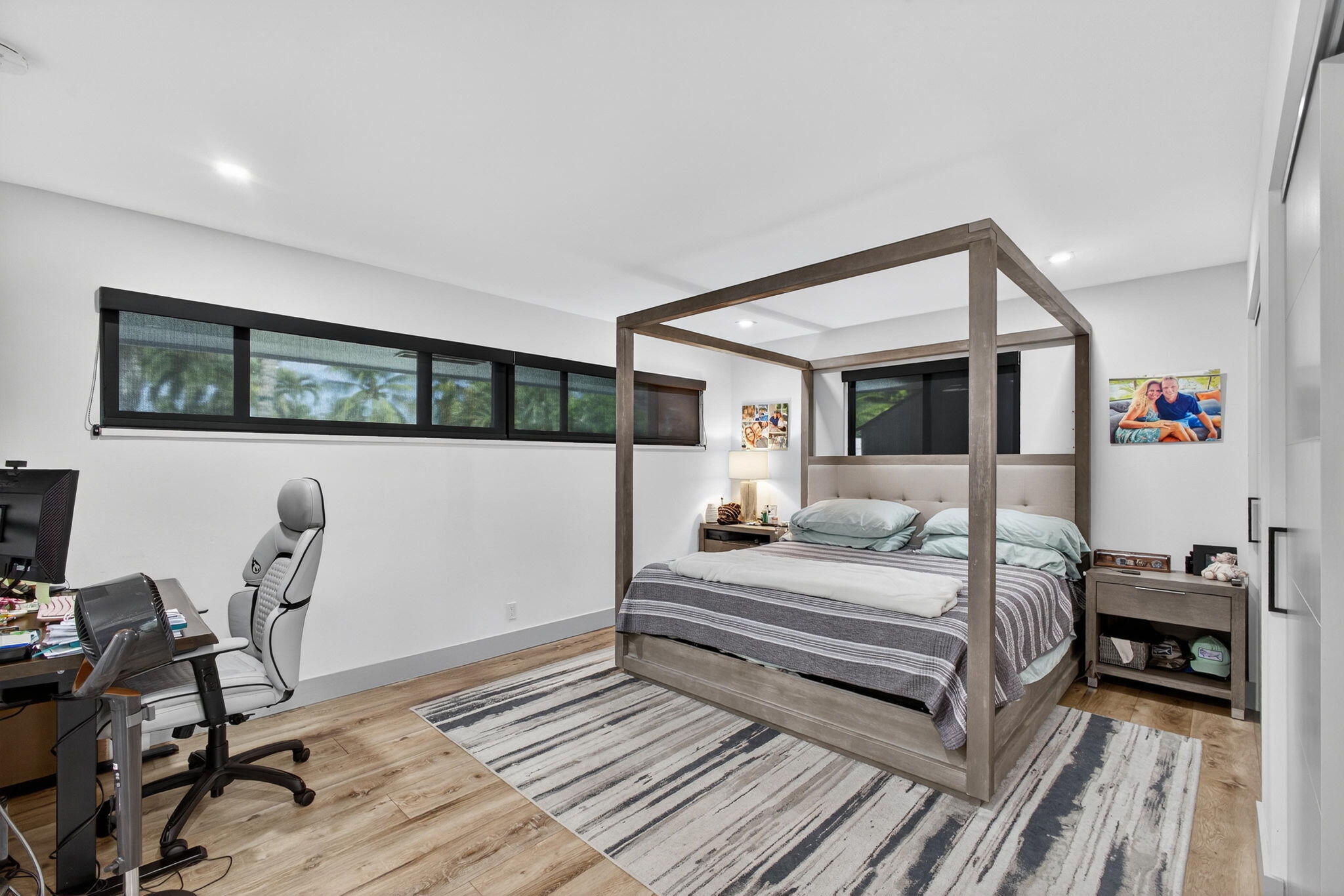 12 Leeward Circle Tequesta, FL 33469 - Photo 24 of 61 a bedroom with a bed and a chair