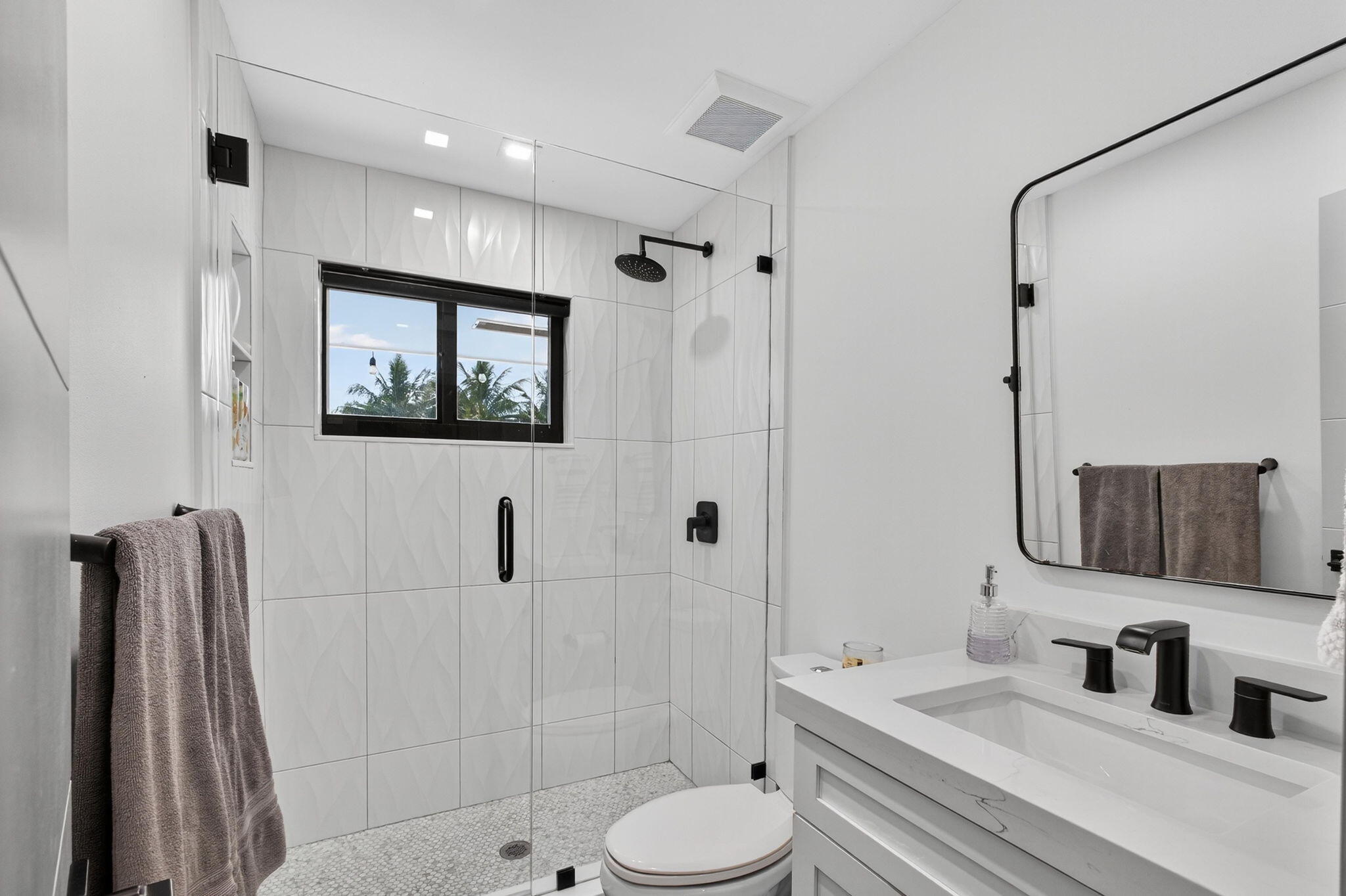 12 Leeward Circle Tequesta, FL 33469 - Photo 27 of 61 a bathroom with a toilet sink and shower