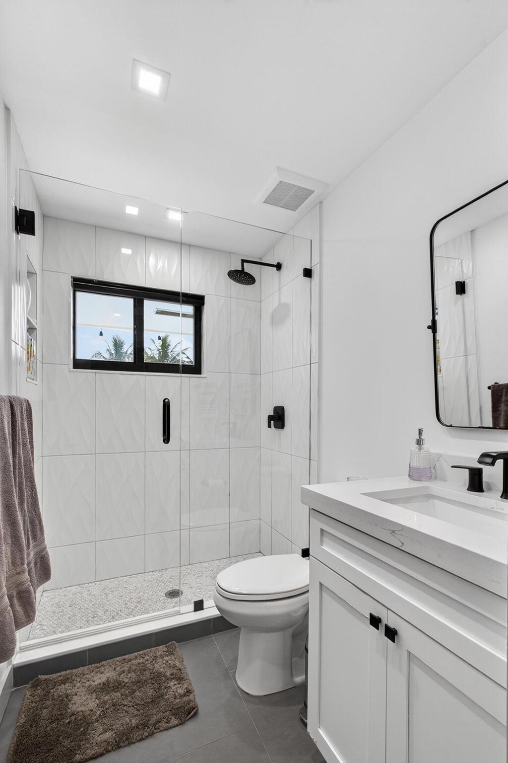 12 Leeward Circle Tequesta, FL 33469 - Photo 28 of 61 a bathroom with a toilet a sink and shower