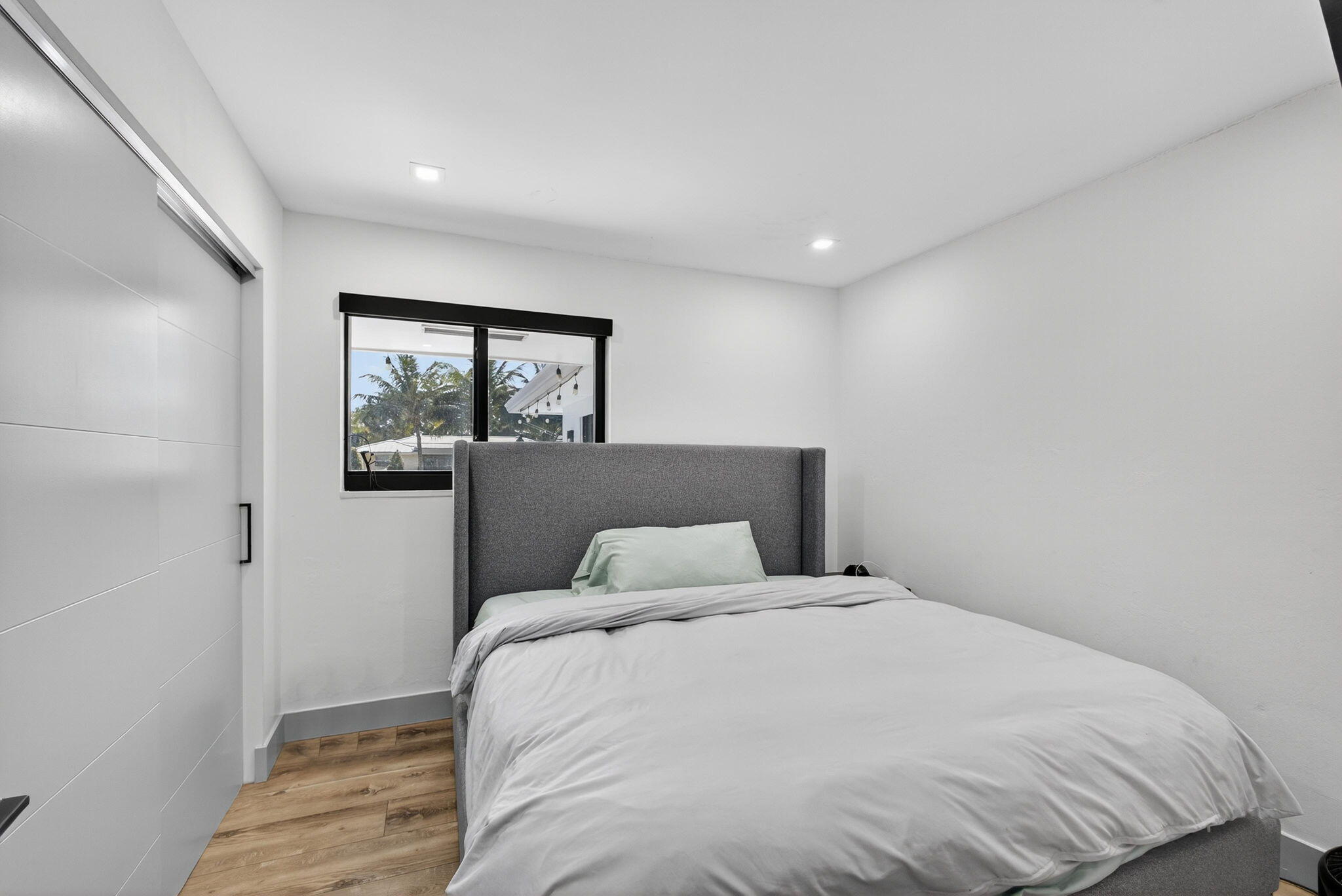 12 Leeward Circle Tequesta, FL 33469 - Photo 29 of 61 a bedroom with a large bed and a window