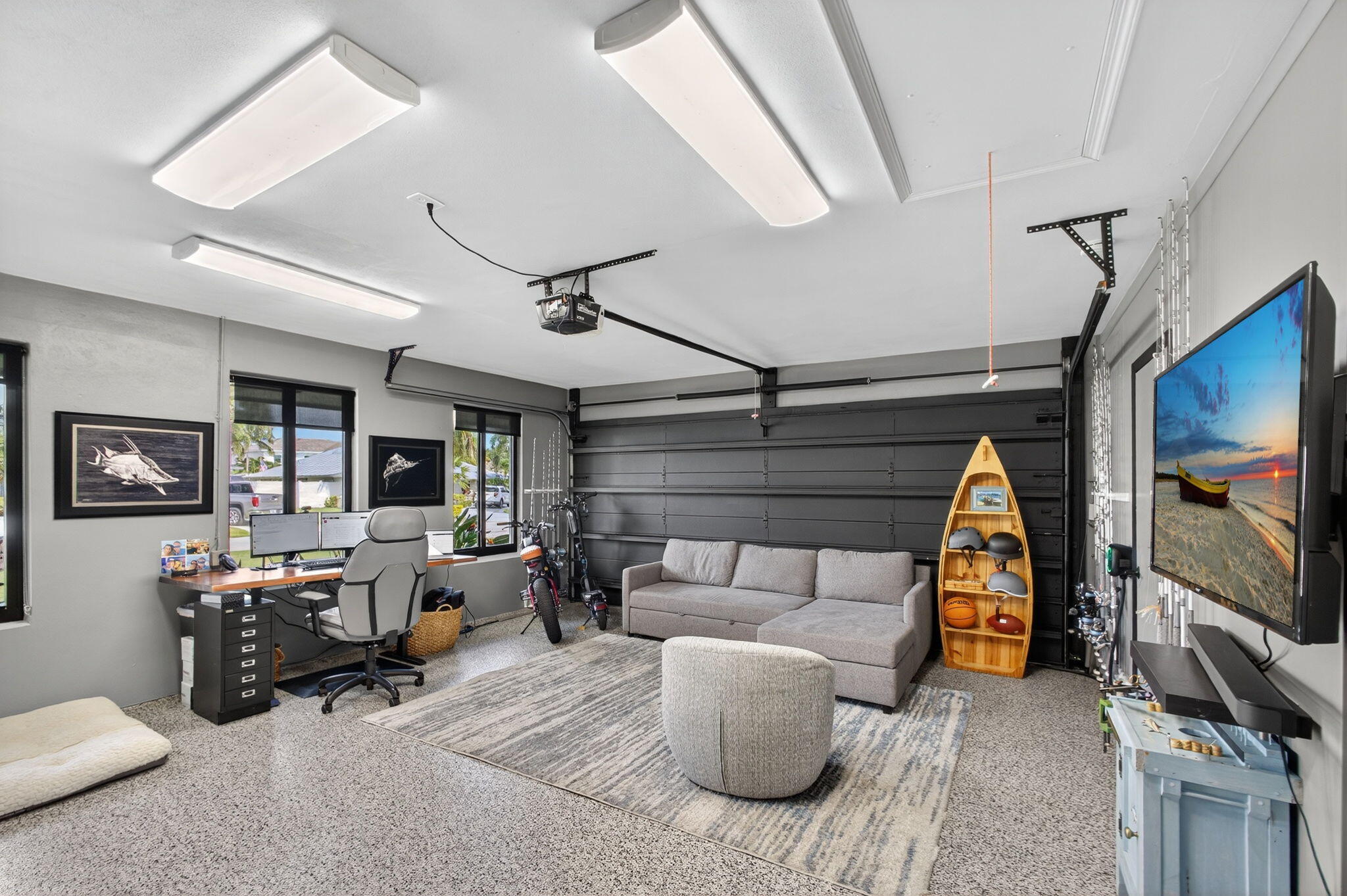 12 Leeward Circle Tequesta, FL 33469 - Photo 36 of 61 a living room with furniture a flat screen tv and a fireplace