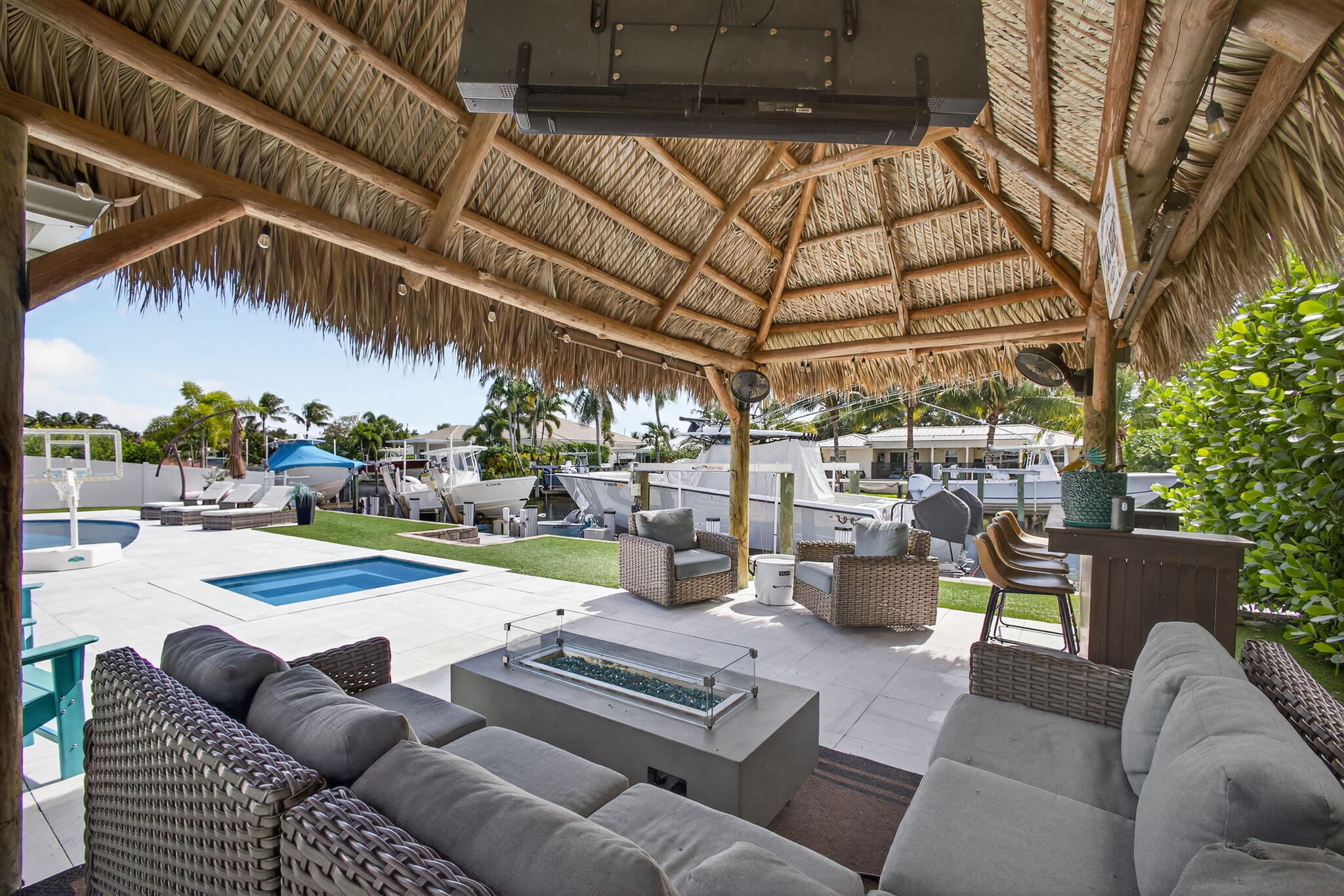 12 Leeward Circle Tequesta, FL 33469 - Photo 41 of 61 a view of a patio with couches and a fire pit
