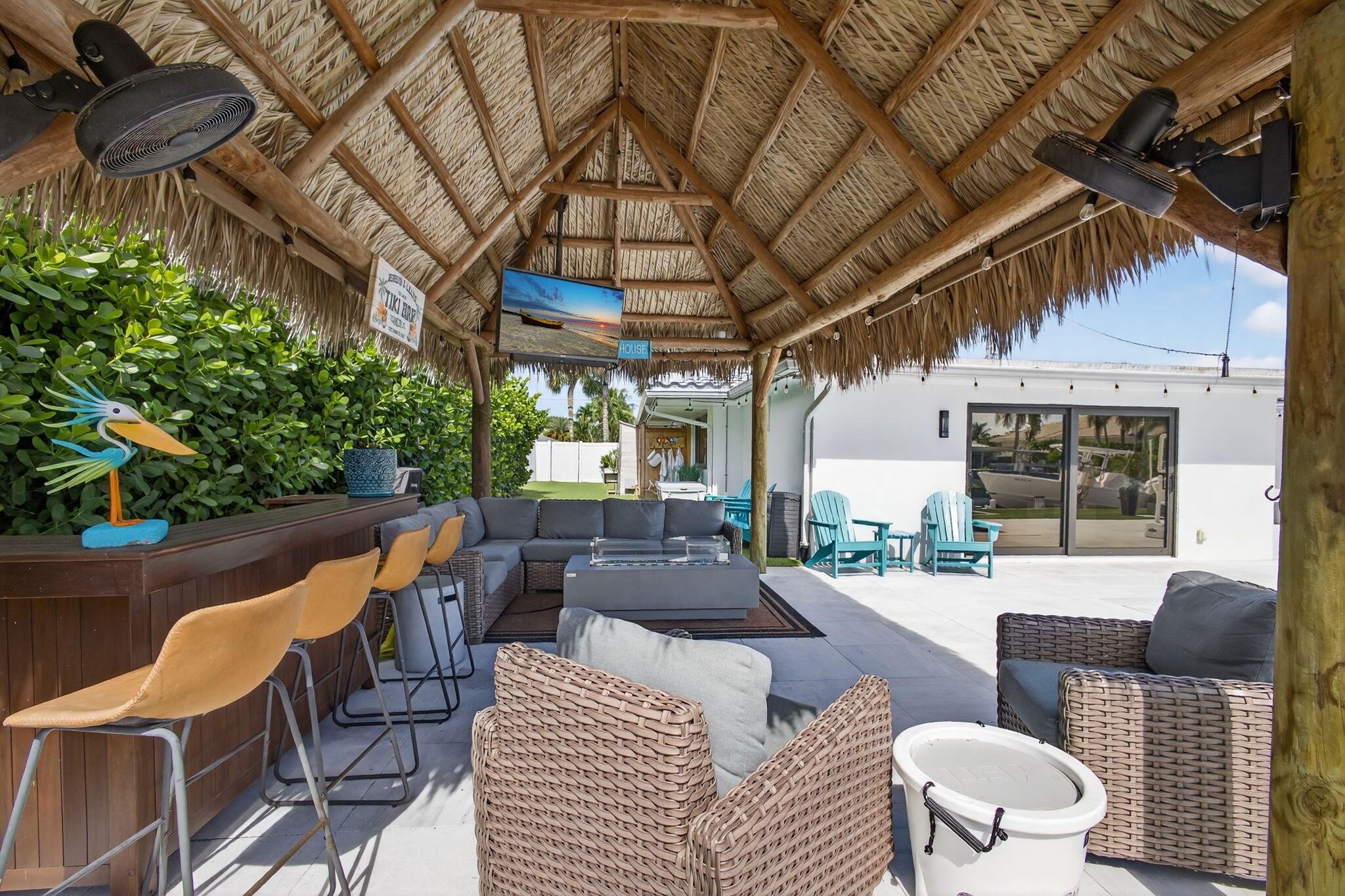 12 Leeward Circle Tequesta, FL 33469 - Photo 42 of 61 a view of a patio with couches table and chairs and potted plants