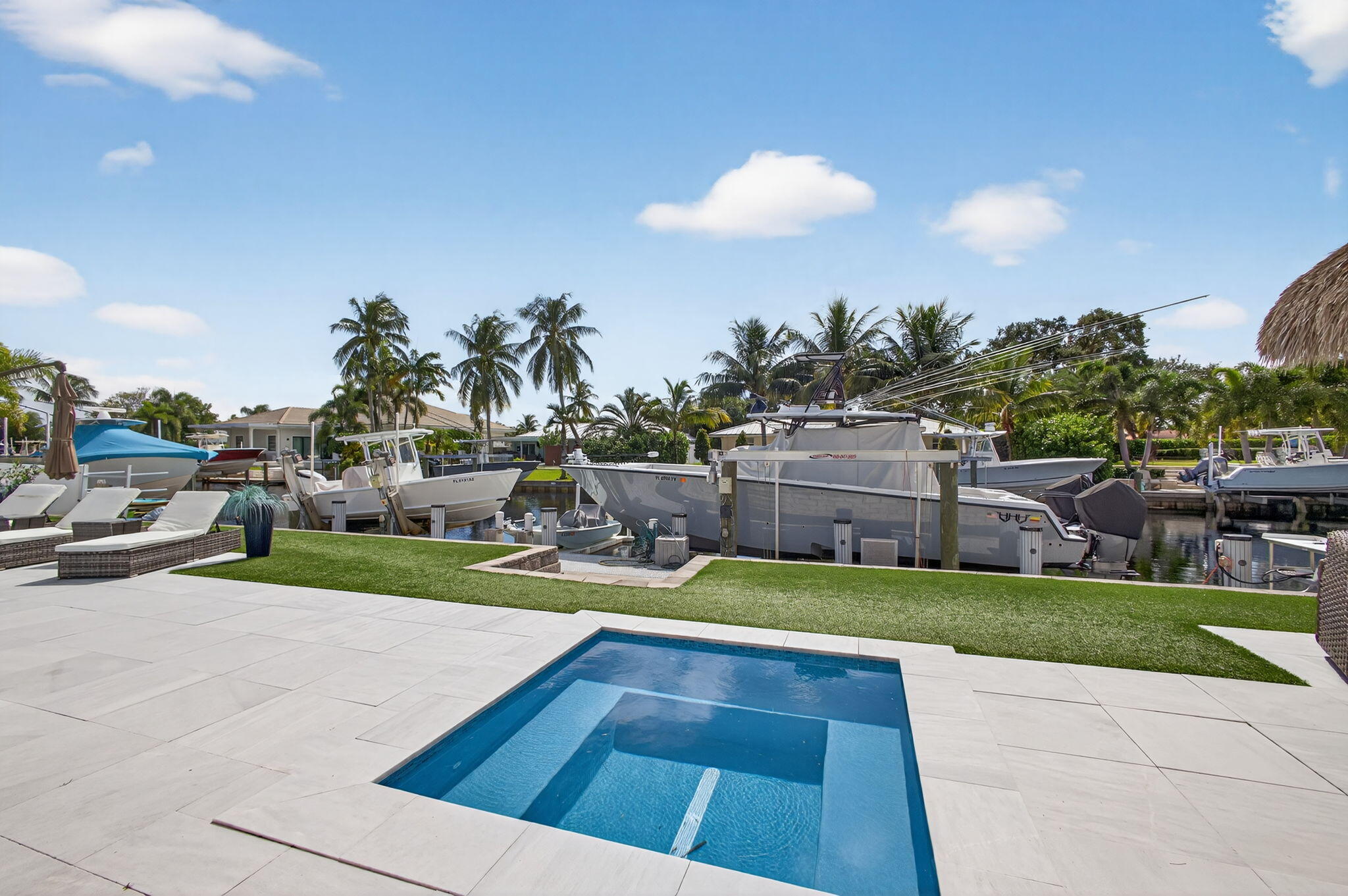 12 Leeward Circle Tequesta, FL 33469 - Photo 45 of 61 a view of a house with swimming pool yard and sitting area