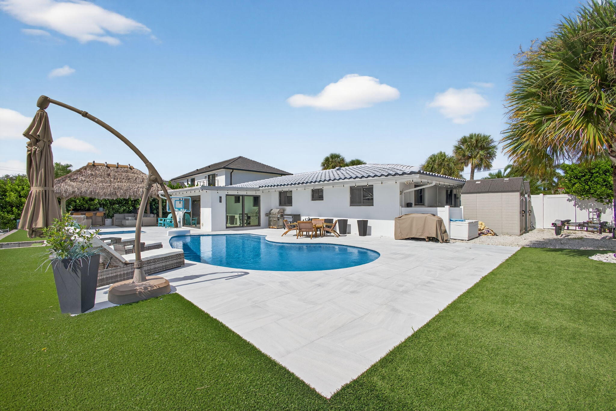 12 Leeward Circle Tequesta, FL 33469 - Photo 46 of 61 a view of a house with backyard and sitting area