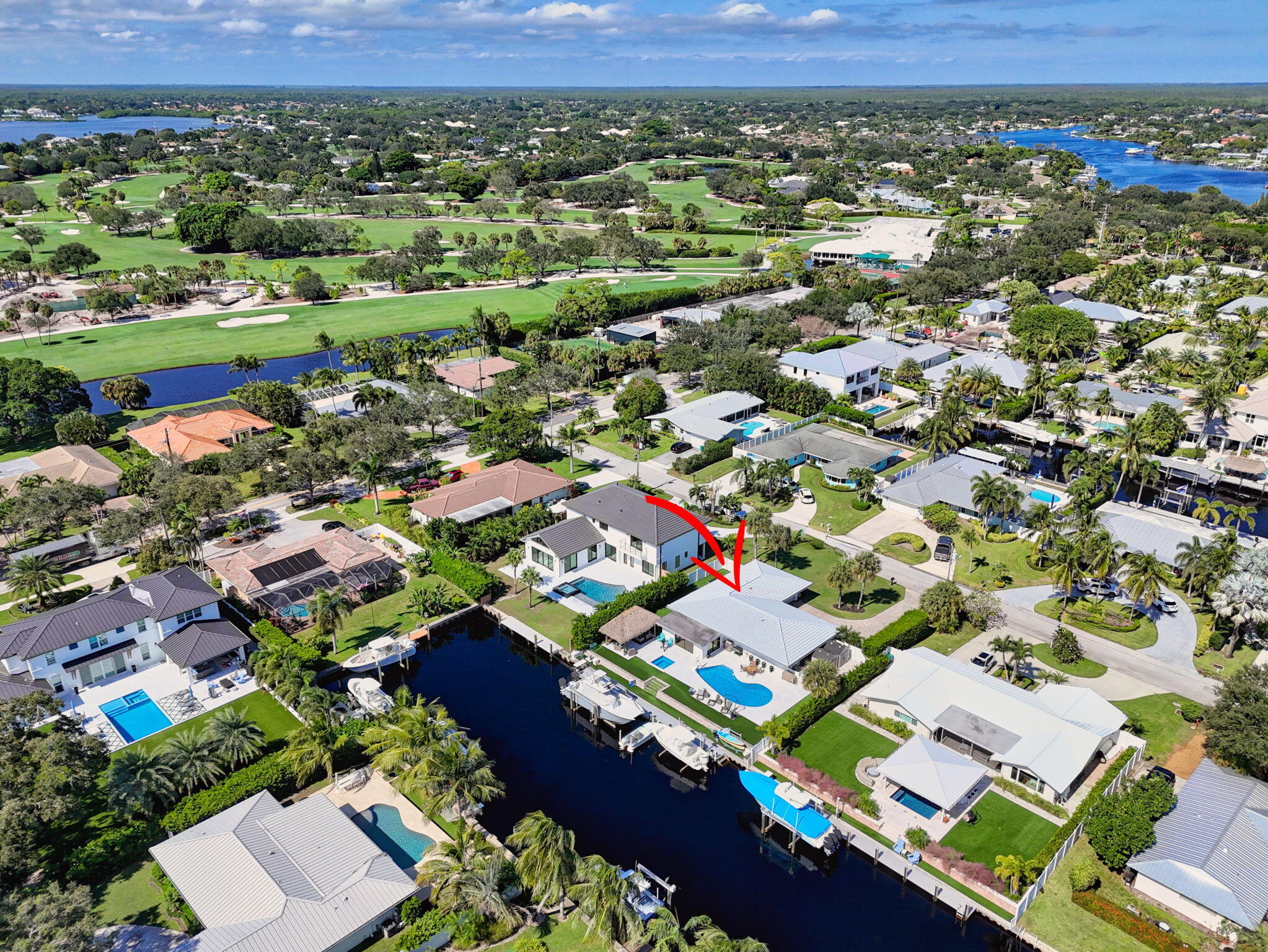 12 Leeward Circle Tequesta, FL 33469 - Photo 49 of 61 an aerial view of residential houses with outdoor space and parking